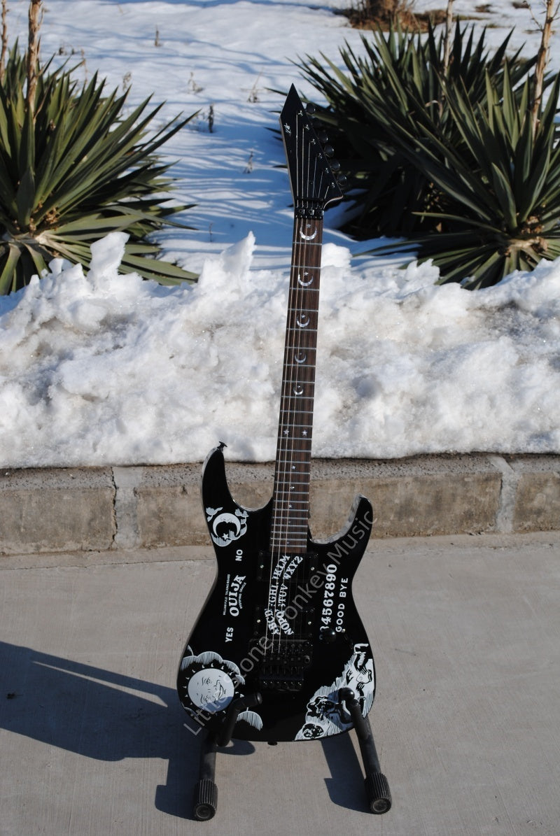 Electric Guitar With Sun And Moon Patterns