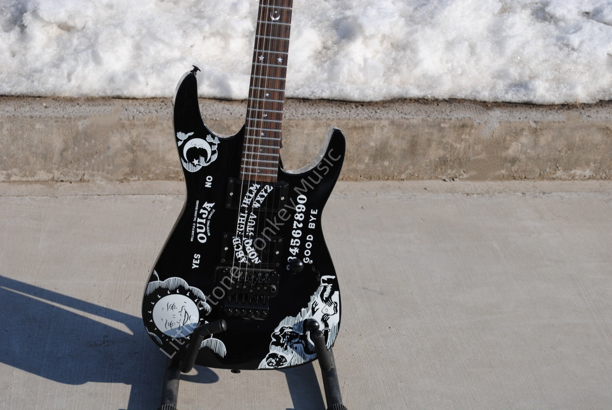 Electric Guitar With Sun And Moon Patterns