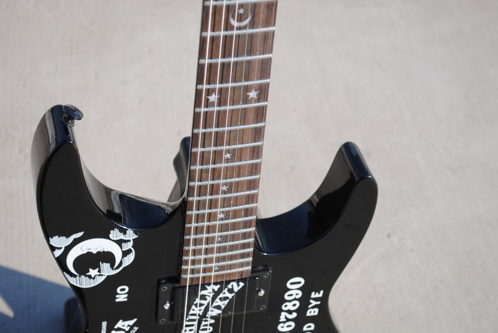 Electric Guitar With Sun And Moon Patterns